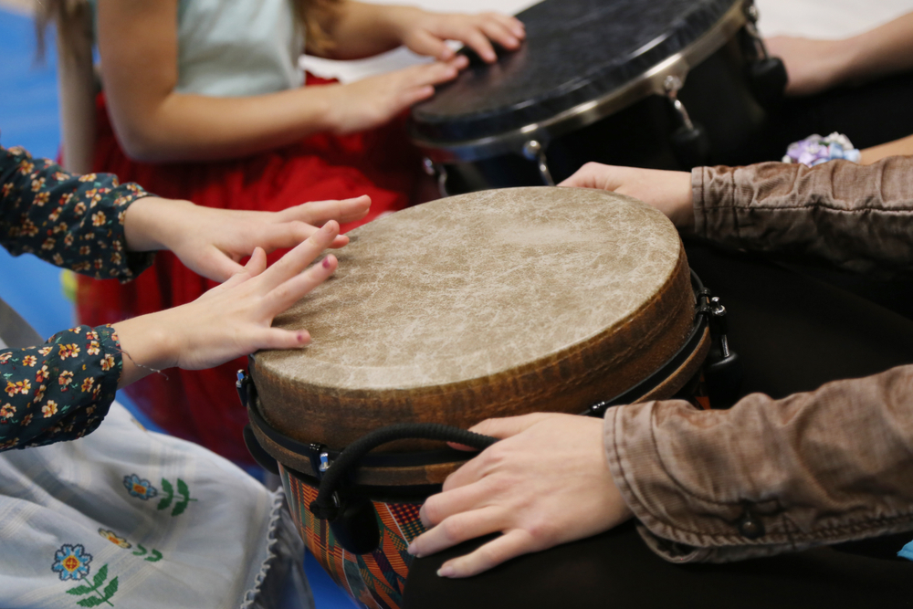 Kids,Play,Jembe,Drum,In,A,Montessori,Music,Therapy,Classroom
